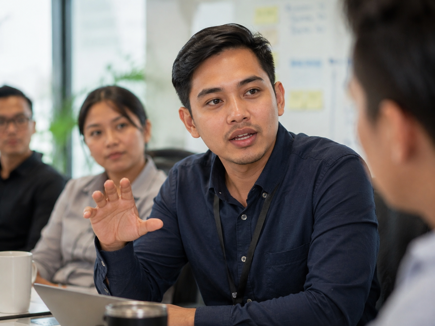 Filipino working professional in a meeting